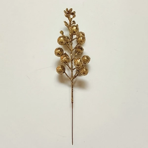 Close-up of a decorative gold glitter berry branch for festive Christmas tree DIY crafts