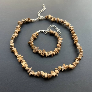 Detailed macro view of natural irregular picture jasper stone necklace and bracelet set
