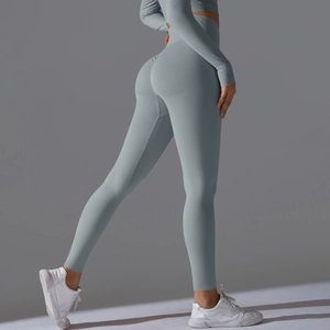Detail of high waist yoga pants with scrunch butt design in blue knit fabric