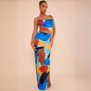 Women's two-piece set featuring abstract print crop top and pleated maxi skirt