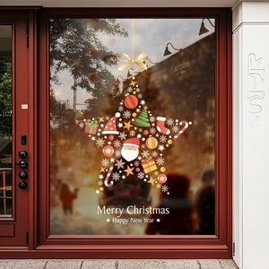 Christmas tree window decal with Santa and stars on a glass door for holiday decoration
