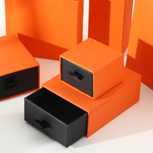 Premium orange drawer jewelry box set with matching gift bags and black ribbon pull