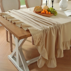 Minimalist beige washed cotton tablecloth with elegant ruffled pleated edges for rectangle dining table