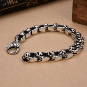 Silver skull link bracelet in vintage stainless steel with lobster clasp for men