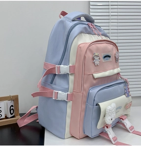 Detail view of colorful student backpack with cute badges and side adjustable buckles