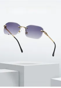 Detail of rimless rectangle sunglasses with purple gradient lenses and diamond hinges