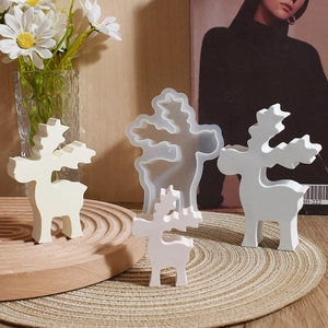 Detailed view of Christmas reindeer resin silicone molds with finished plaster ornaments