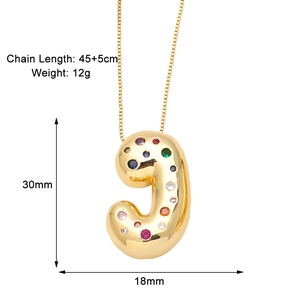 Detail view of 18k gold plated J-letter pendant with vibrant colorful zircon stones