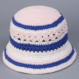 Close-up of pink, white, and blue handmade crochet knit pattern on bucket hat