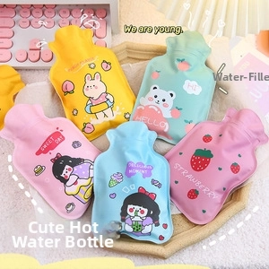 Detail of five cute cartoon silicone coin purses in various colors on a wooden tray