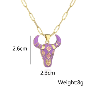 Detailed size view of a gold-plated bull head pendant with purple enamel details