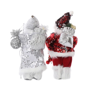 Detail of Santa Claus figures showing sequined fabric capes and miniature gift bags