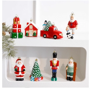 Close-up of assorted festive Christmas tree ornaments featuring Santa Claus and nutcrackers
