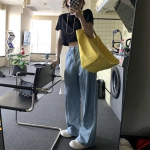 Large yellow canvas shoulder bag for women with minimalist high-capacity design
