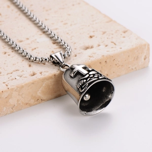 Retro stainless steel cross bell pendant with vintage finish on a round box chain