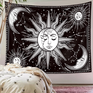 Detail of bohemian sun and moon tapestry with celestial pattern in a minimalist bedroom