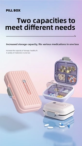 Close-up of portable pill box with seven numbered compartments and secure metal buckle