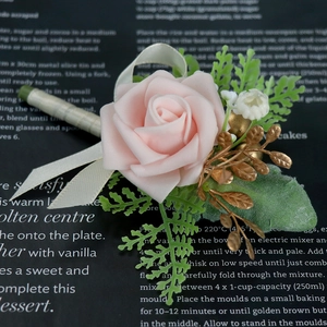 Pink PE rose groom boutonniere with green ferns and gold leaves for wedding events