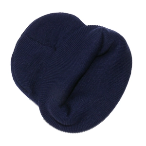 Close-up of navy blue ribbed knit beanie featuring detailed mountain peak embroidery
