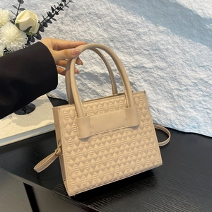 Elegant apricot quilted leather tote bag with crossbody strap and top handle design