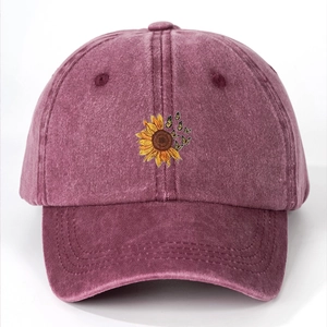 Washed cotton baseball cap in burgundy with sunflower and butterfly embroidery detail