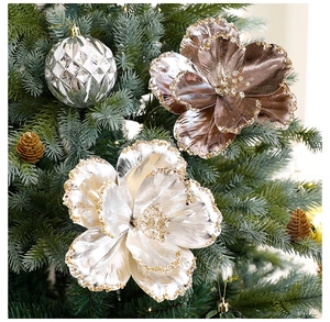 Detail of champagne and bronze artificial Christmas flowers with glitter on tree branches