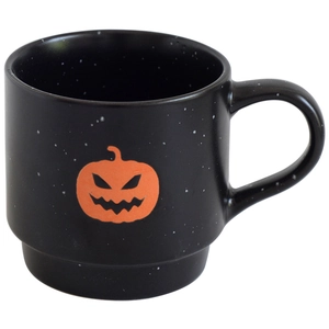 Stackable black ceramic Halloween mug with orange pumpkin lantern and white dots