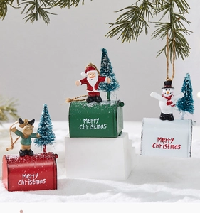 Detailed view of red, green and white Christmas mailbox ornaments with festive motifs