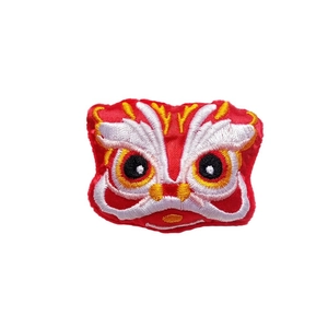 Traditional red Chinese lion dance embroidery patch with intricate festive details