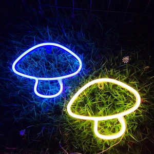 Blue and yellow LED mushroom neon signs on night grass for wall decor lighting