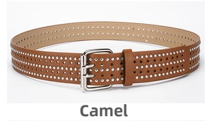 Detail of camel punk belt featuring silver studs, star cutouts and a double prong buckle