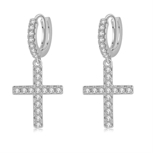 Close-up of hip hop silver cross earrings with sparkling cubic zirconia inlay detail