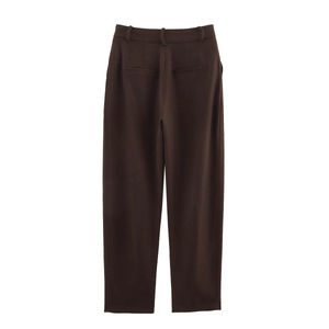 Detail view of the back of high-waisted dark brown straight-leg suit trousers with pockets