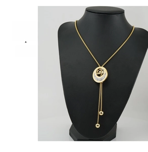Close-up of 18K gold stainless steel necklace pendant with Love ring and crescent moon
