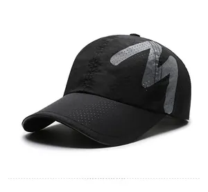 Detail view of black breathable mesh sports cap with large grey M letter print