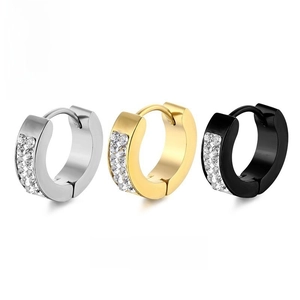 Detailed view of silver, gold and black titanium steel ear cuffs with zircon stones