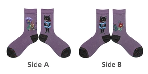 Detailed close-up of purple cotton socks featuring black cat and floral embroidery patterns
