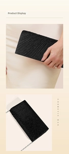 Close-up of black pleated evening clutch bag with glitter texture and silver chain strap