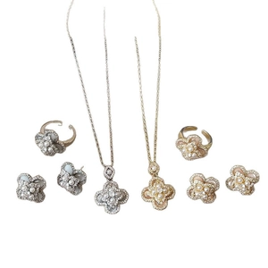 Elegant flower jewelry set with zircon pearls and cat-eye stones including necklace and ring
