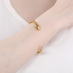 Vintage gold punk snake head open bracelet with detailed scale texture on wrist