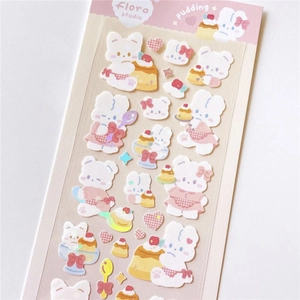 Close-up of cute rabbit pudding stickers with laser silver glitter finish for DIY crafts