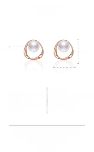 Detailed view of pearl earrings in copper with rose gold finish and product specifications