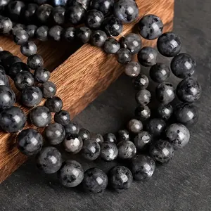 Natural black labradorite round beads strings for jewelry making on dark wooden box