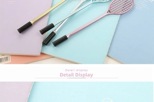 Detail display of creative badminton racket pens in metallic gold, silver, pink, and blue