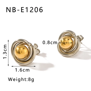 Detail view of bird nest stud earrings with gold spheres and size markings