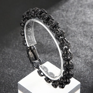 Detail of 316L stainless steel skull bracelet with black finish and secure clasp