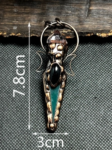 Macro detail of bronze goddess pendant with amethyst crystal and agate stone measurements
