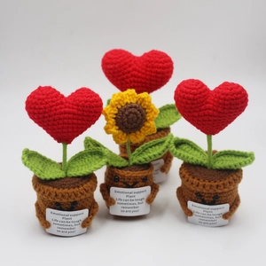 Handmade crochet emotional support plants with sunflower and hearts on a white background