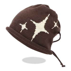 Detailed close-up of coffee brown knit beanie with white star patterns and rolled edge