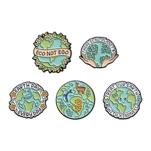 Set of 5 eco-friendly enamel pins with Earth Day slogans and animal motifs on white background